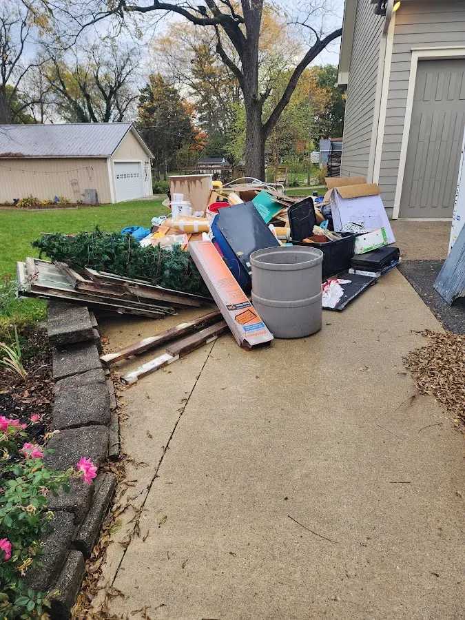 Dumpster being loaded with debris for 30 Yard Dumpster Rental in Perryton
